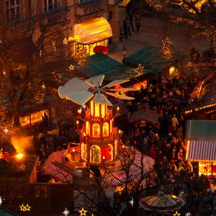 An aerial view of one of the Christmas markets in Germany and the cozy ambiance that makes them popular.